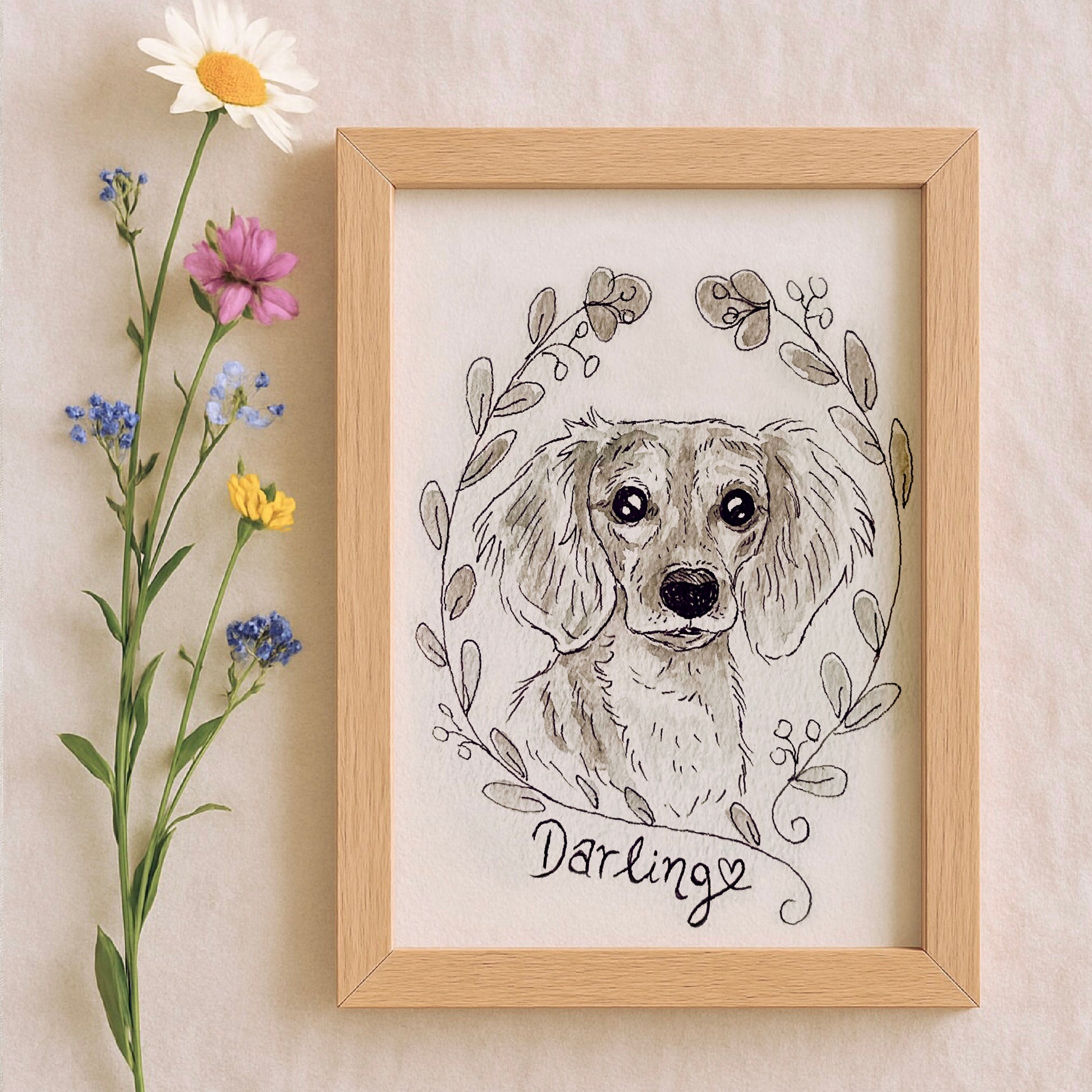 Framed watercolor illustration of a dog with floral elements and the word 'Darling' on a beige wall.